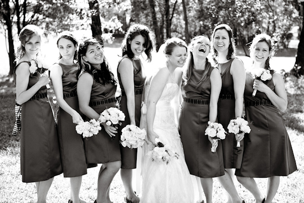 black and white photo - bride and her bridesmaids having fun during the photo session - photo by North Carolina based wedding photographers Cunningham Photo Artists